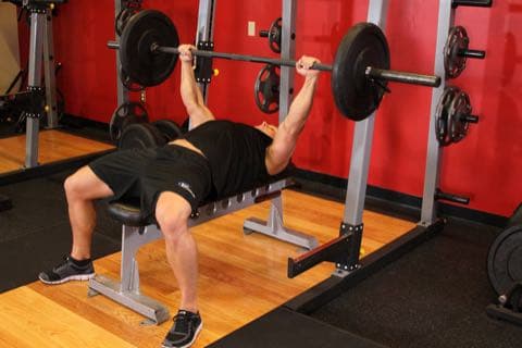 Barbell Bench Press - Medium Grip: start and end position of the movement